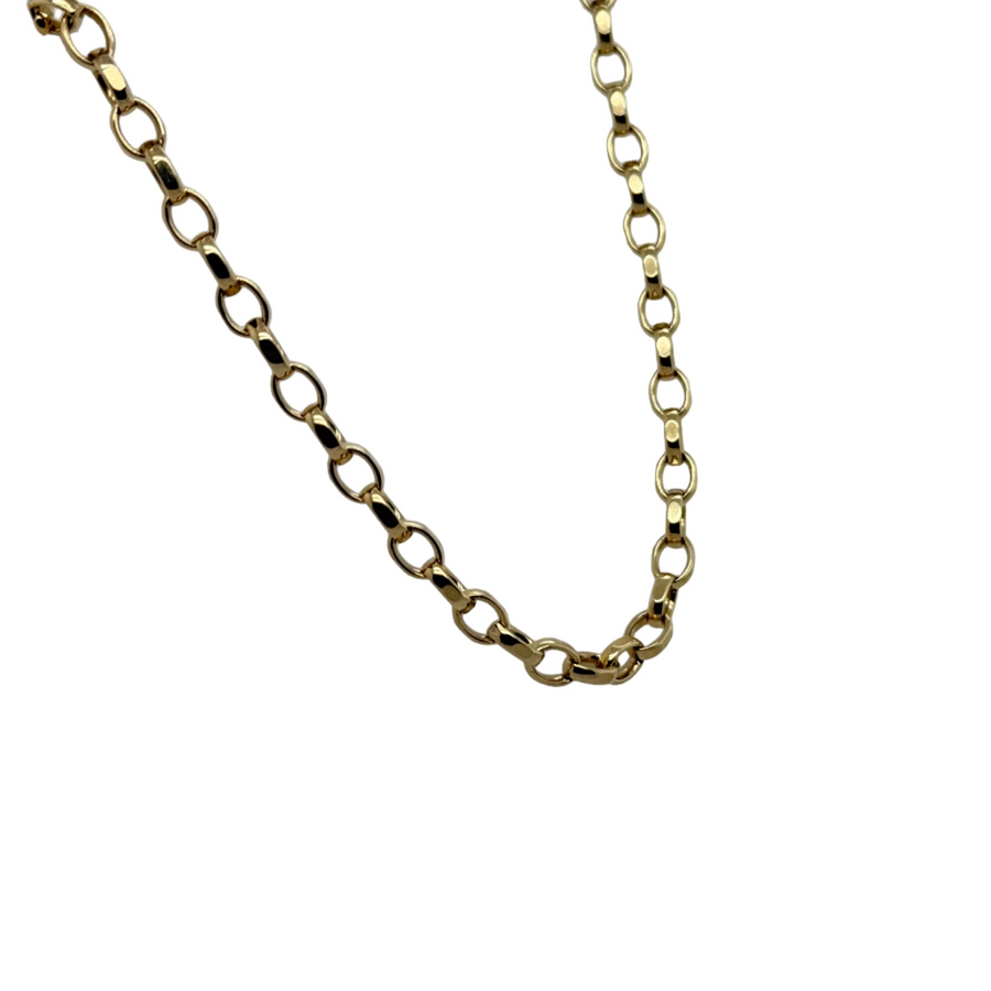 Gold chain necklace on a white mannequin bust against a light gray background