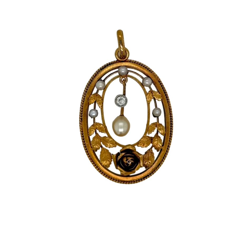 Gold pendant with pearls and a central gemstone on a white background